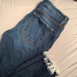 Skinny Blue jeans distressed at ankle and hip